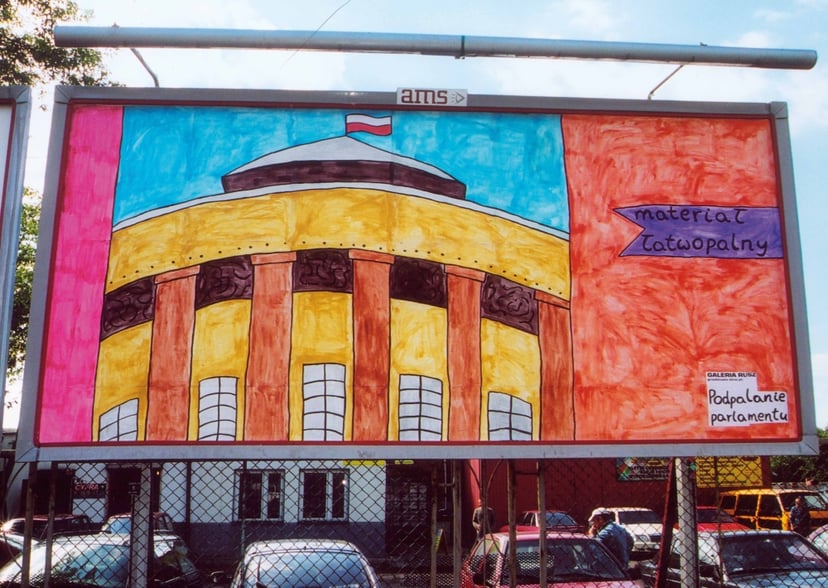 Podpalanie parlamentu, 2004, bilbord, Toruń, (RG)